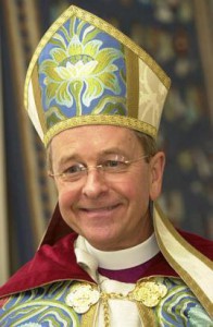 Bishop Gene Robinson in religious garb, smiling