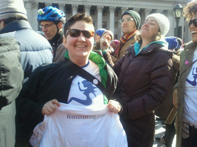 Miriam in a Feministing shirt at a protest