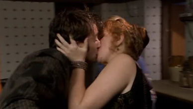 Donna kisses the Doctor to shock his system in The Unicorn and the Wasp