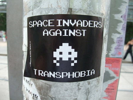 Sign on a tree: Space Invaders Against Transphobia