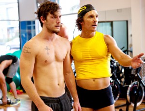 Matthe McConaughey wears a yellow tank top and black boy shorts, and teaches topless Alex Pettyfer to look at himself in the mirror
