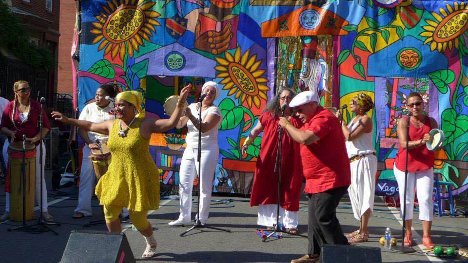 Legacy Women is an all-women's traditional musical group rooted in Afro-Dominican and Afro-Puerto Rican traditions. Image via Mi Gente!