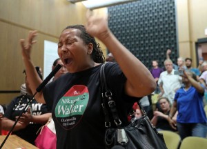 Walker disrupts a City Council meeting on August 21, 2017 asking the Council, "Why did you think you could do a business as usual after what happened [with Klan violence] on the 12th?"