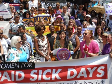 Activists gather at a rally held to mark the launch of a new Women for Paid Sick Days Initiative. Gloria Steinem along with Ai-jen Poo and others are calling for paid sick days in New York.