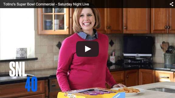 screenshot of smiling housewife from SNL skit