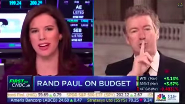 screenshot of Paul Rand shushing female reporter