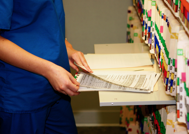 nurse with patient files