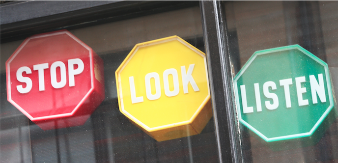 Image of three octagonal shapes, the first is red and says "STOP" the second is yellow and says "LOOK" and the third is green and says "LISTEN"