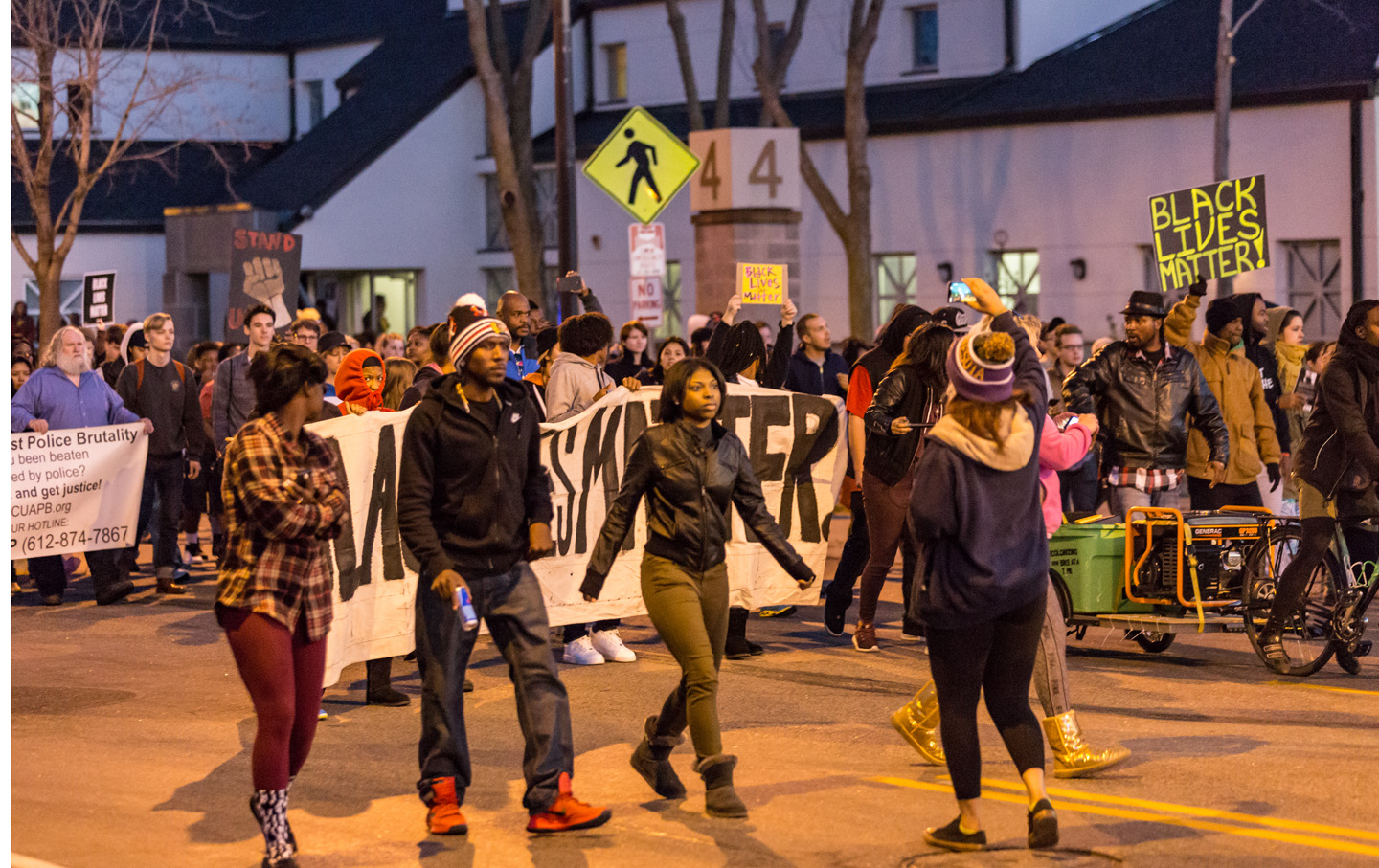 Black Lives Matter activists march along Plymouth Avenue North in front of the 4th Precinct station, toward the Minneapolis Urban League, where Mayor Betsy Hodges and Chief Janee Harteau held a community listening session regarding the officer-involved shooting of Jamar Clark, on November 15, 2015.

Photo: Tony Webster
tony@tonywebster.com