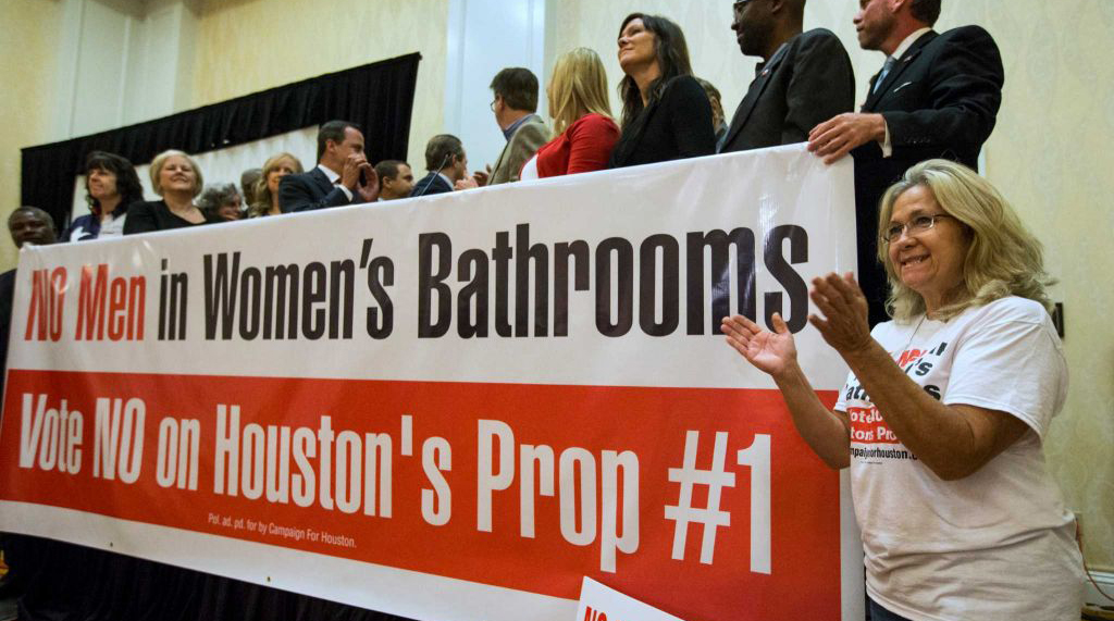 Opponents of HERO with a No Men in Women's Bathrooms sign