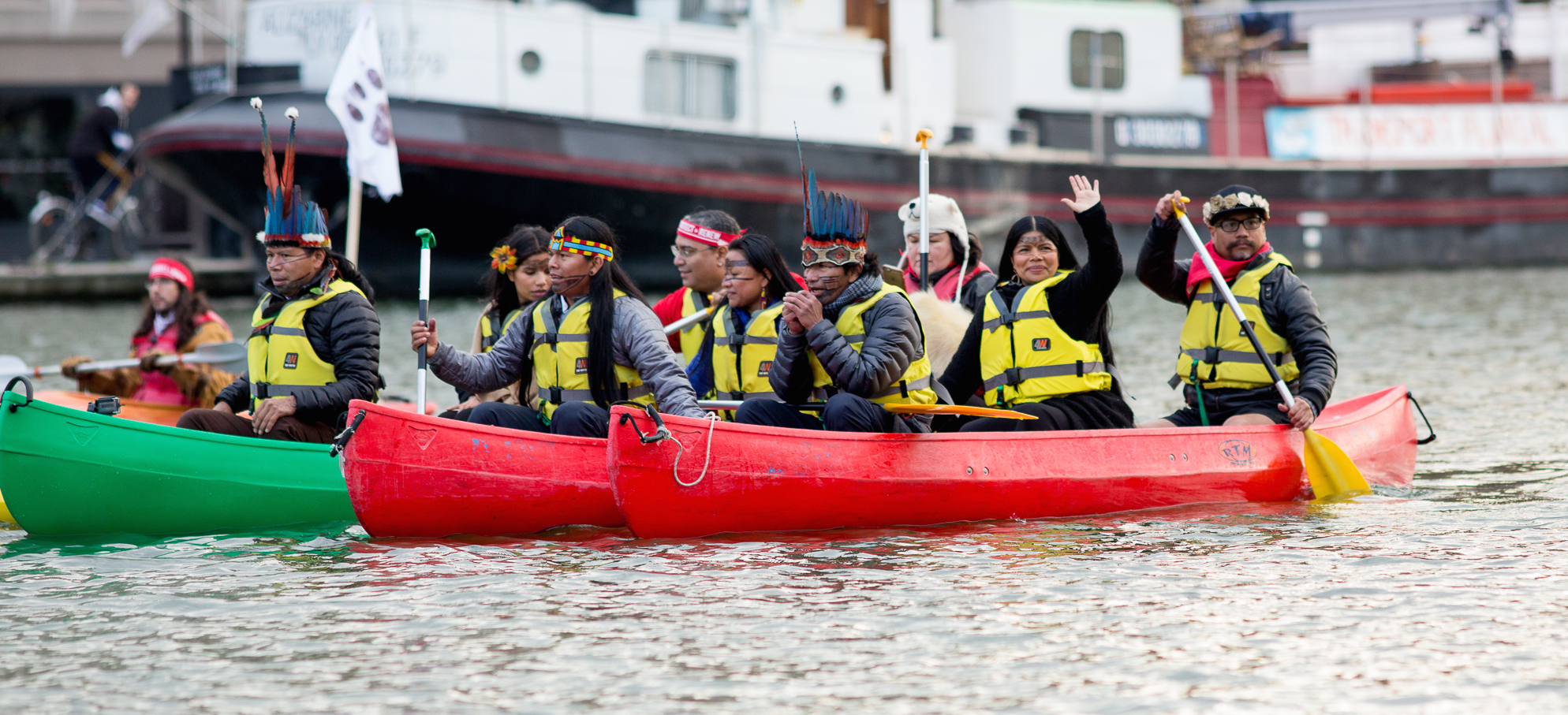 PARIS, FRANCE-- Indigenous Peoples from the Arctic to the Amazon gathered to demand "true climate solutions including bottom up initiatives originating in Indigenous knowledge, culture, and spirituality." The Indigenous flotilla canoed and kayaked on the Bassin de la Villette during COP21 in Paris. On December 6, 2015, the COP21 entered its 7th day of negotiations at the United Nations Climate Change conference. The COP21 is being held in Paris, France, at the Le Bourget conference center. Photos by: Emma Cassidy | Survival Media Agency