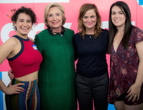 Hillary Clinton and Amy Poehler stand with two white TV actresses.