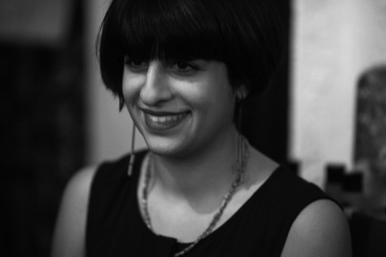 Mitra Kaboli smiles in a black and white image