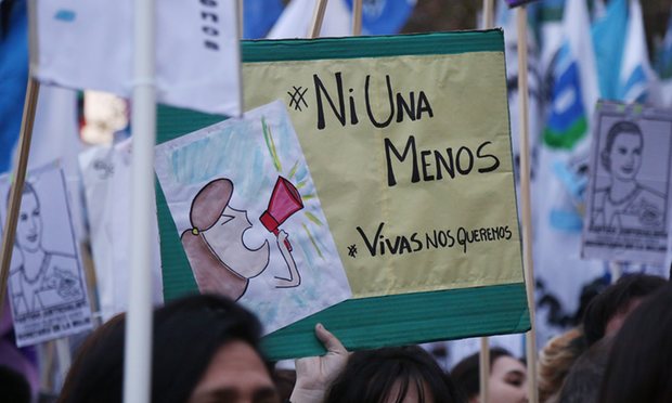 A protester holds a placard bearing the words ‘Ni Una Menos’ – ‘Not one less’ – at a June women’s rights rally in Buenos Aires.