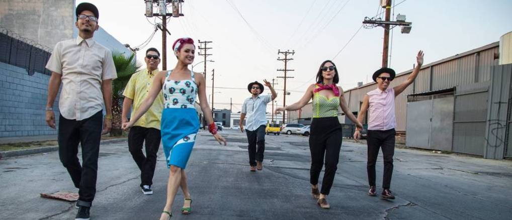 Members of the band walk through the streets of LA.