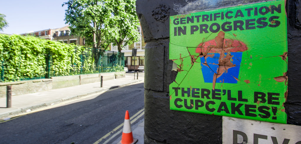 Street sign reading: "Gentrification in progress. There will be cupcakes!"