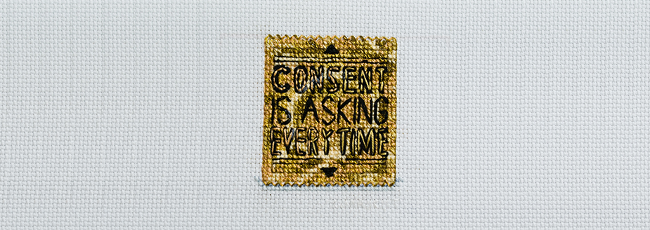 A gold condom wrapper reads "consent is asking everytime."