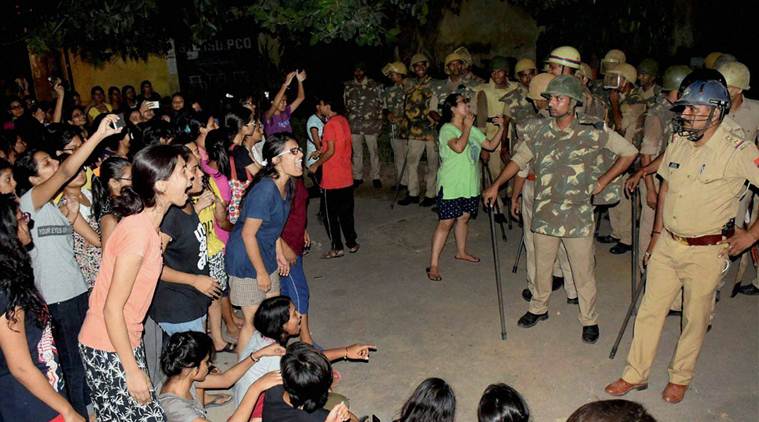 Varanasi: Students and police in a standoff in Varanasi late Saturday night. Female students at the prestigious University were protesting against the administration's alleged victim-shaming after one of them reported an incident of molestation on Thursday. PTI Photo  (PTI9_24_2017_000107B)