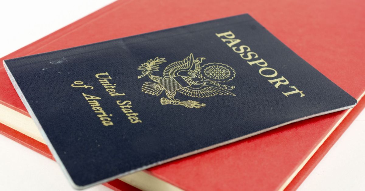 image of a united states passport on top of a closed red book